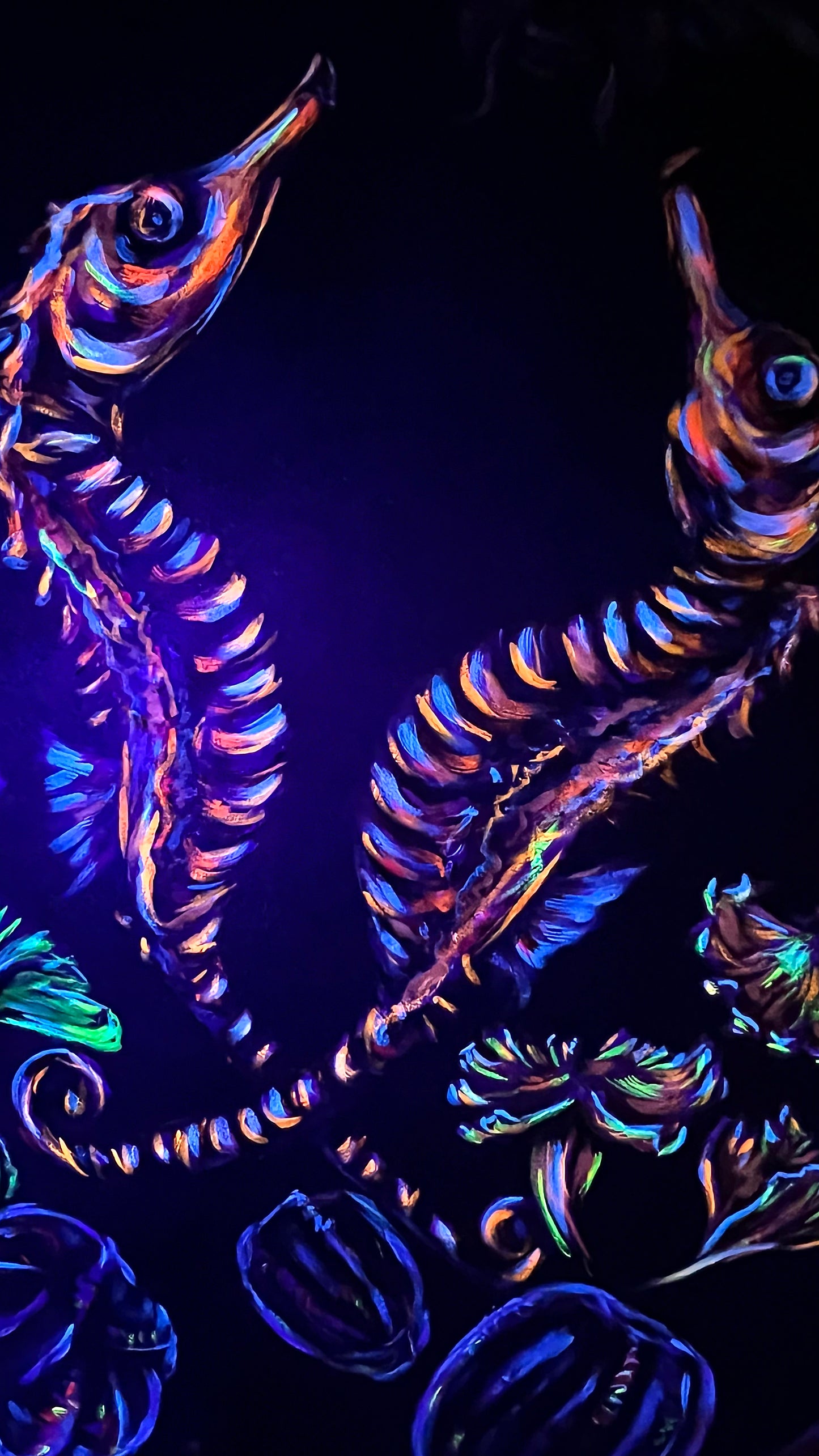 Neon sea horse with floral elements on a dark background